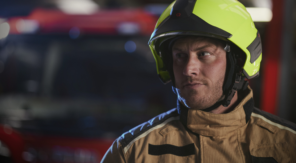 FlamePro - Firefighter in Helmet in front of fire truck - Right Image